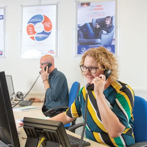 Staff talking on the phones at their desks