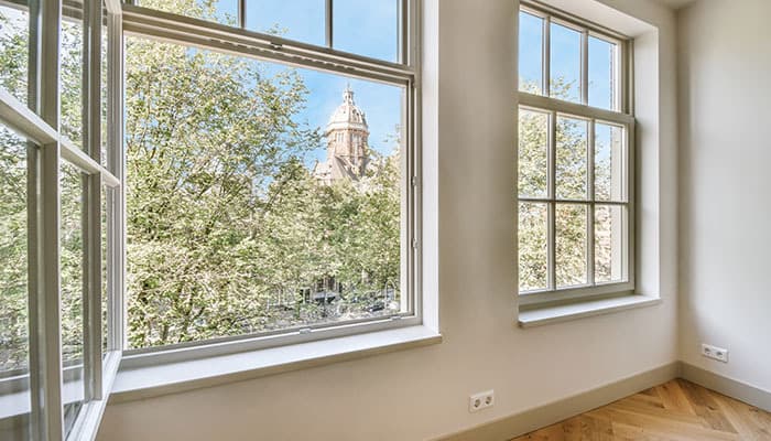 large open window looking out onto some trees